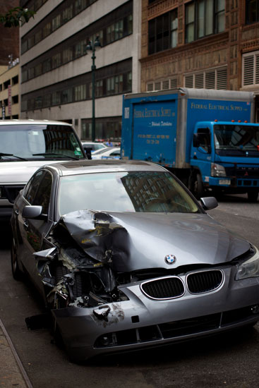 A smashed car on W 35th St