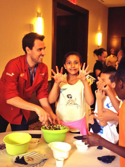 Kids making cookies at the event