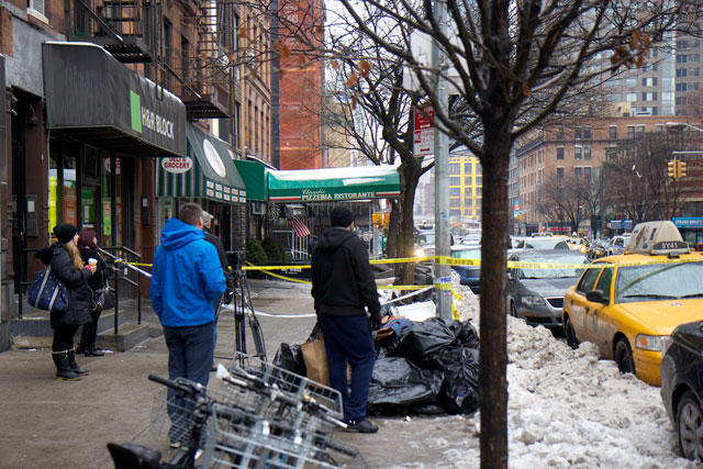Crowds of onlookers watching the building