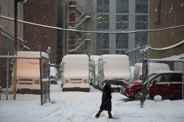 A person walking through heavy snowfall