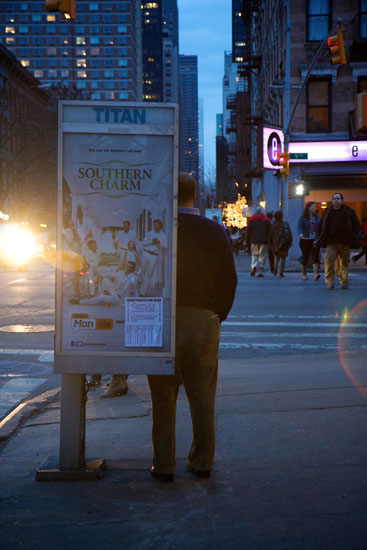 A man using the reinstalled phone booth